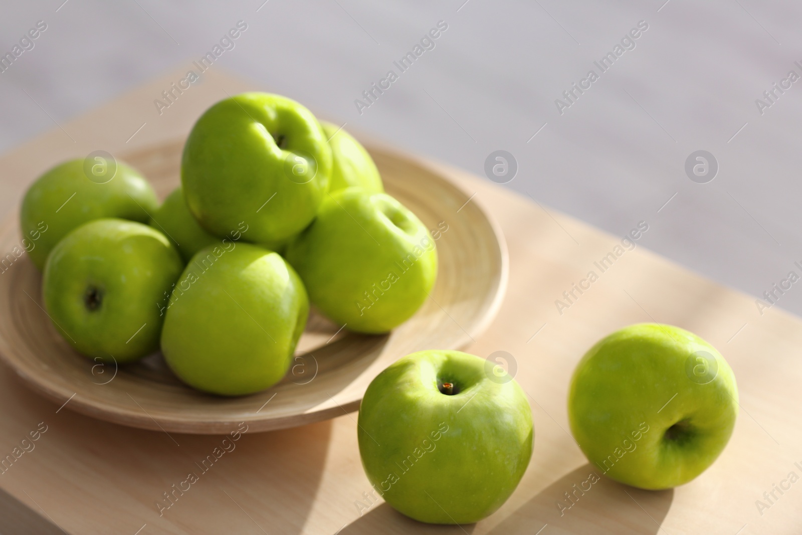 Photo of Ripe green apples on table