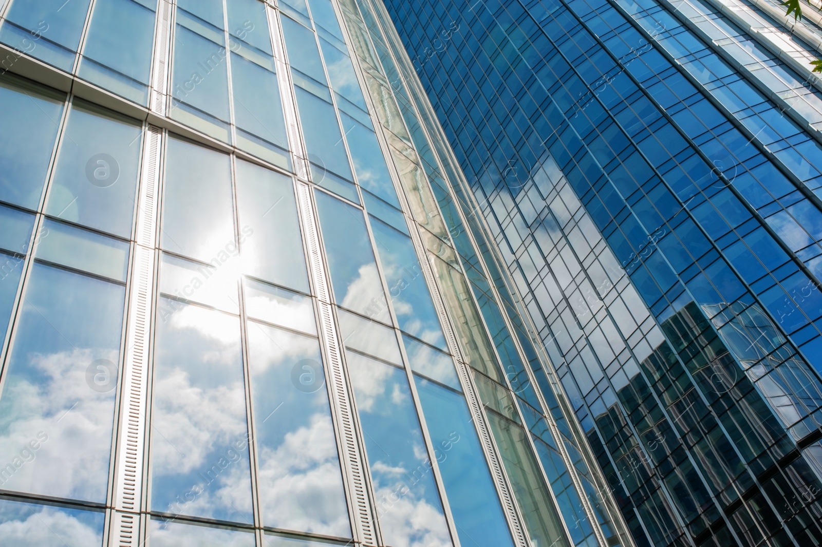 Photo of Beautiful buildings with many windows near cloudy sky