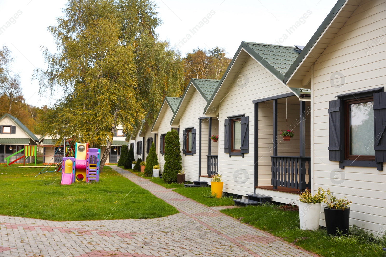 Photo of Beautiful cottage houses near playground. Real estate for rent