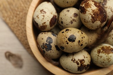 Photo of Speckled quail eggs on table, top view
