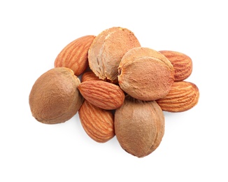 Photo of Organic dried apricot kernels on white background