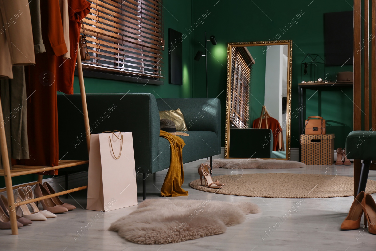 Photo of Modern dressing room interior with stylish furniture and mirror