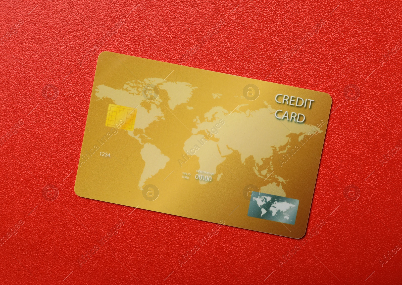 Photo of Credit card on red background, top view