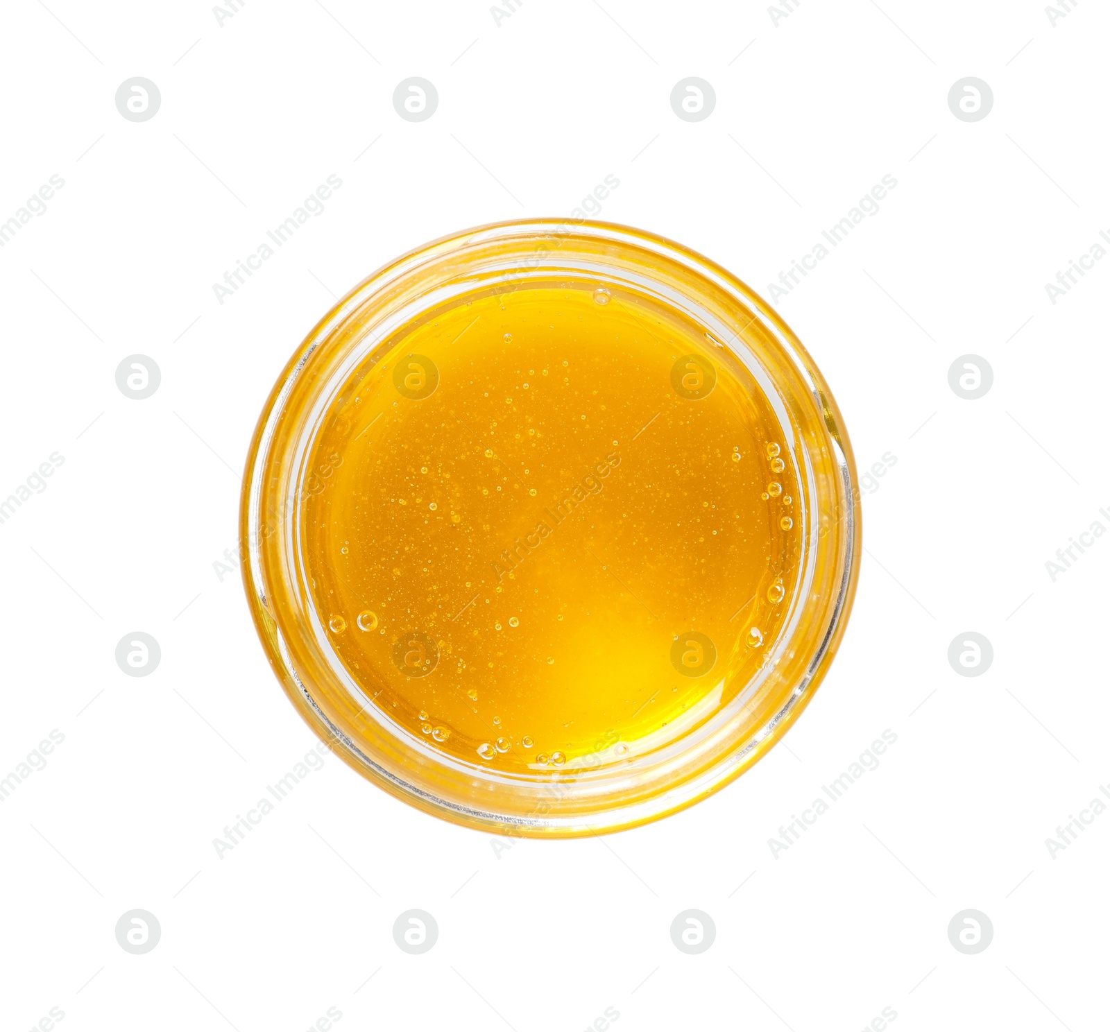 Photo of Tasty honey in glass jar isolated on white, top view