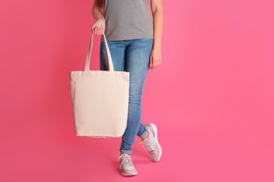 Photo of Woman with eco bag on color background. Mock up for design