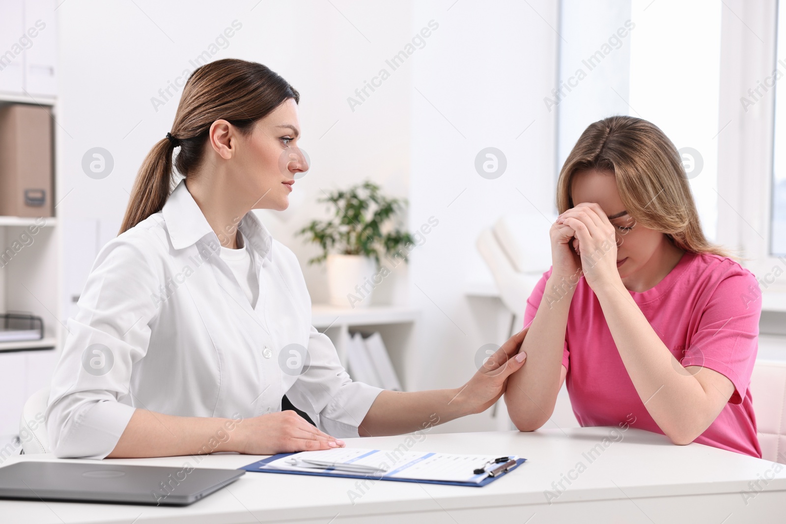 Photo of Mammologist's appointment. Doctor and woman in hospital