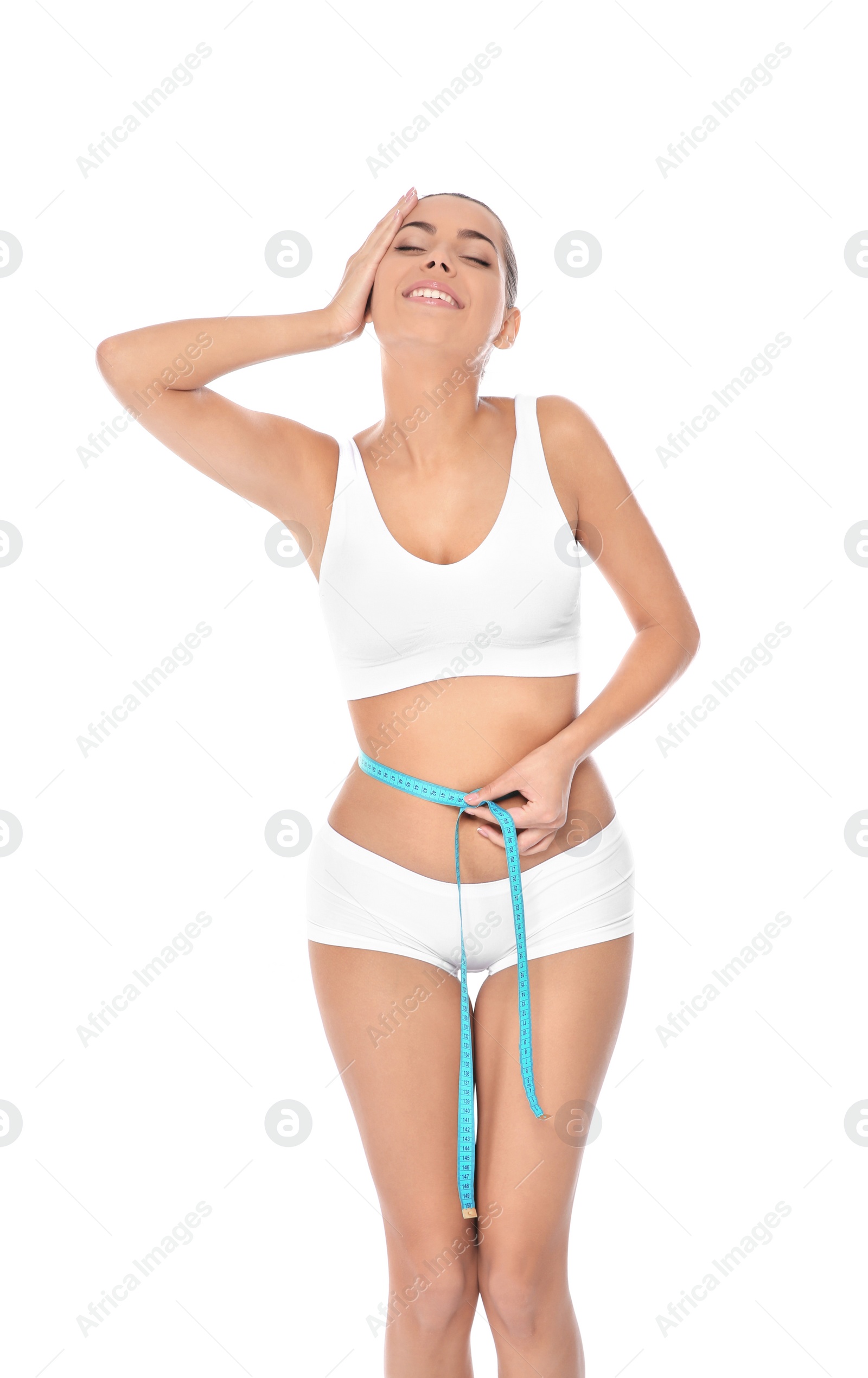 Photo of Slim woman measuring her waist on white background. Weight loss