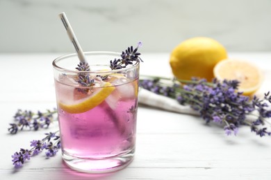 Fresh delicious lemonade with lavender on white wooden table. Space for text