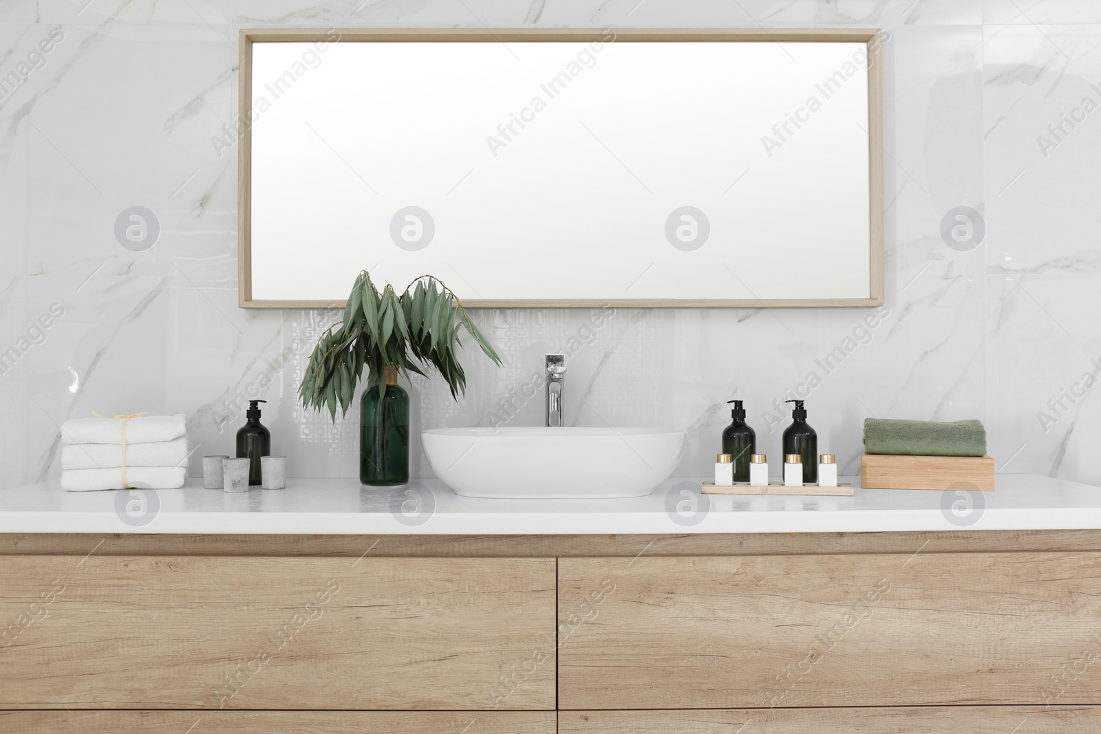 Photo of Modern bathroom interior with stylish mirror and vessel sink