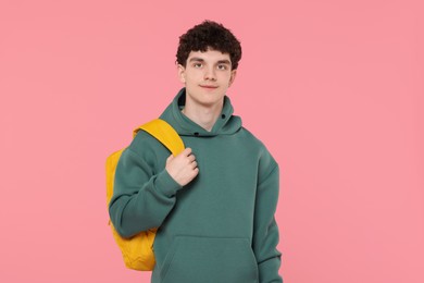 Photo of Portrait of student with backpack on pink background