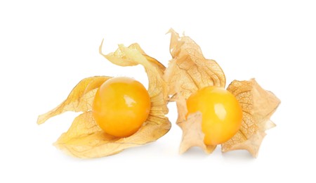 Photo of Ripe physalis fruits with dry husk on white background