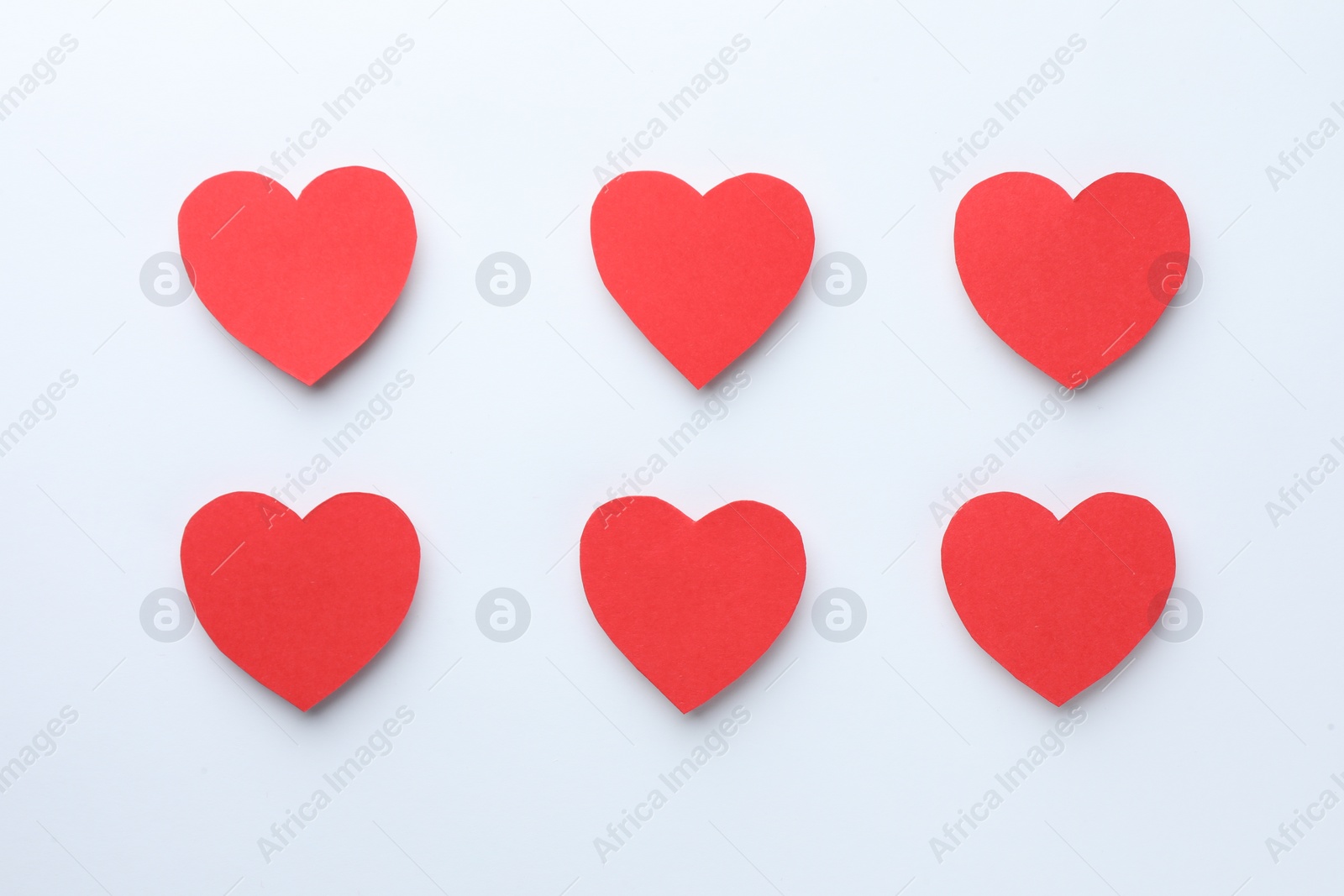 Photo of Paper hearts on white background, flat lay