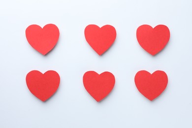 Photo of Paper hearts on white background, flat lay