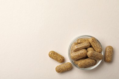 Dietary supplement pills on white background, flat lay. Space for text