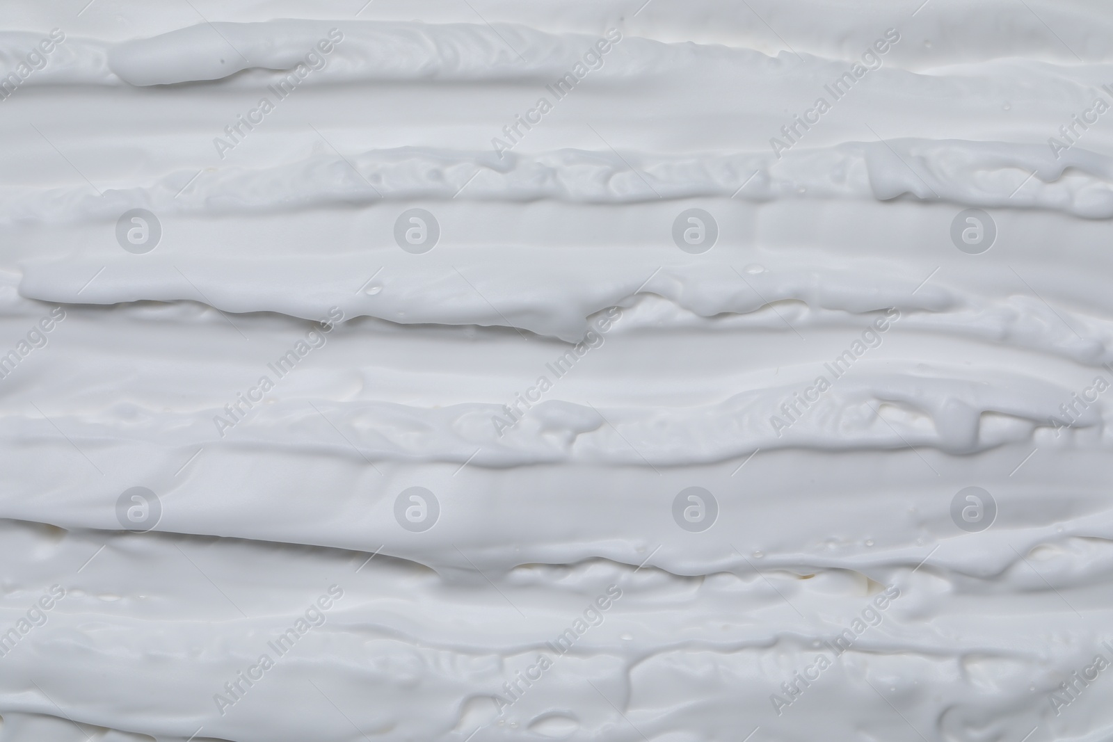 Photo of Texture of white shaving foam as background, top view