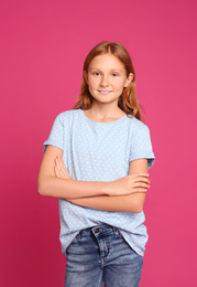 Photo of Portrait of preteen girl on pink background