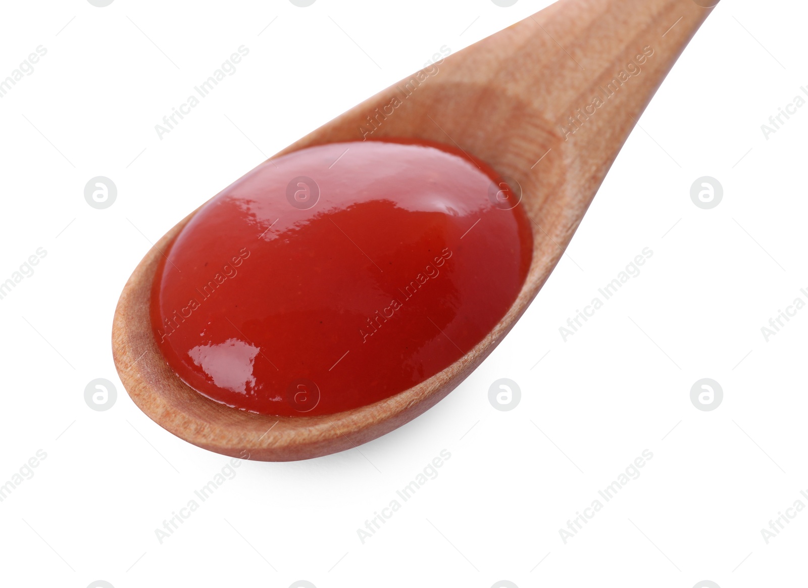 Wooden spoon with tasty fresh ketchup isolated on white Photo of Wooden spoon with tasty fresh ketchup isolated on white