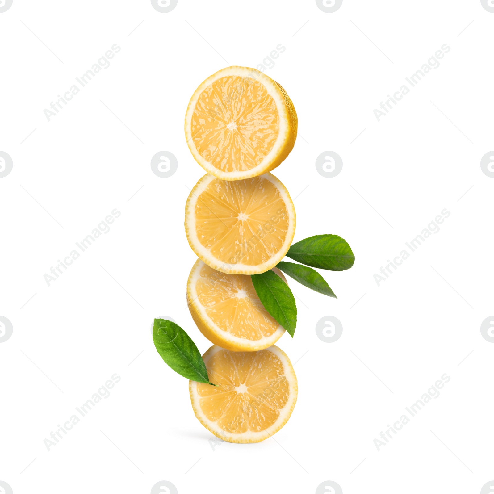 Image of Stack of cut fresh lemons with green leaves isolated on white