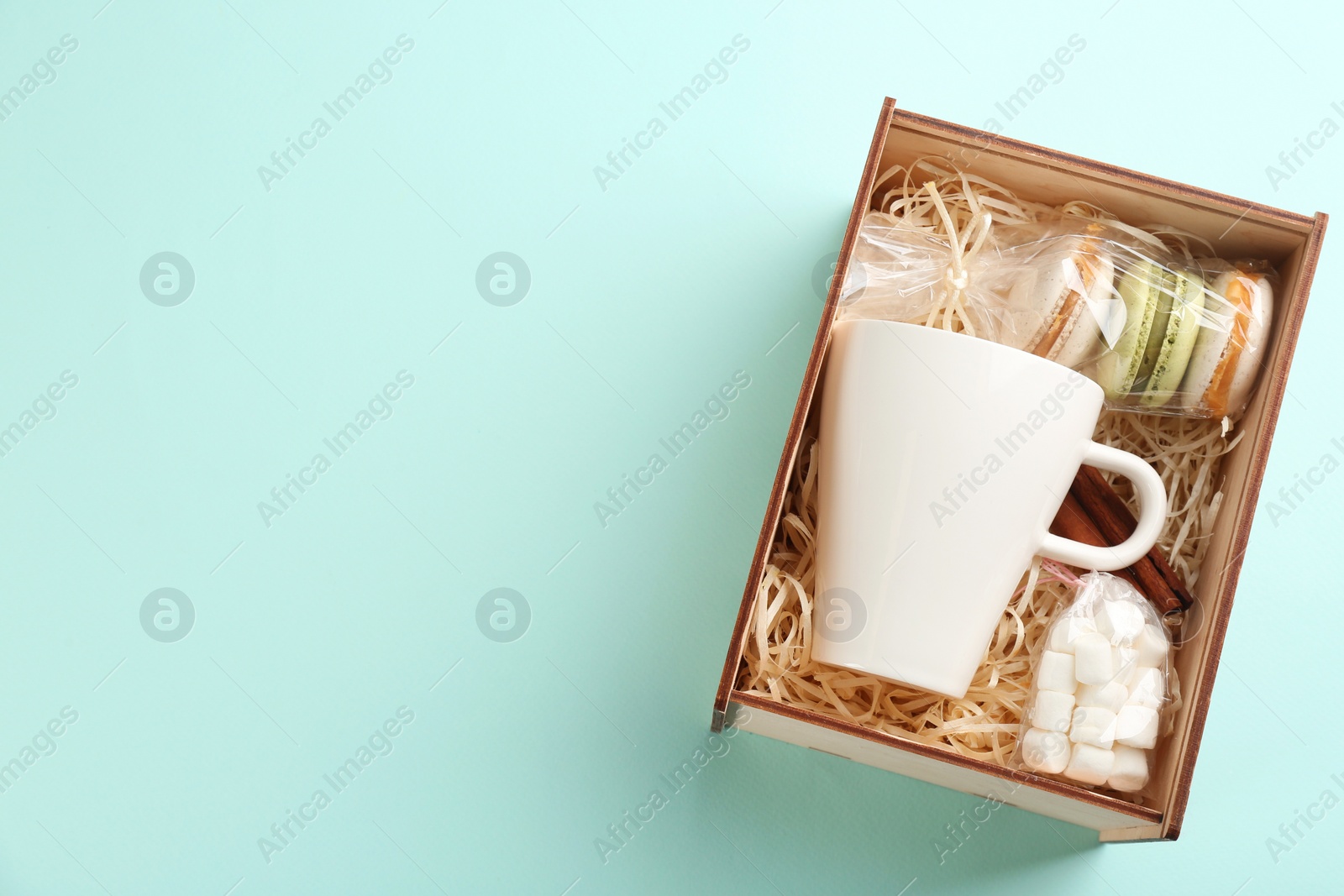 Photo of Stylish gift set on light blue background, top view. Space for text