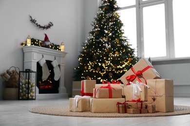 Many different gift boxes and Christmas decor in living room