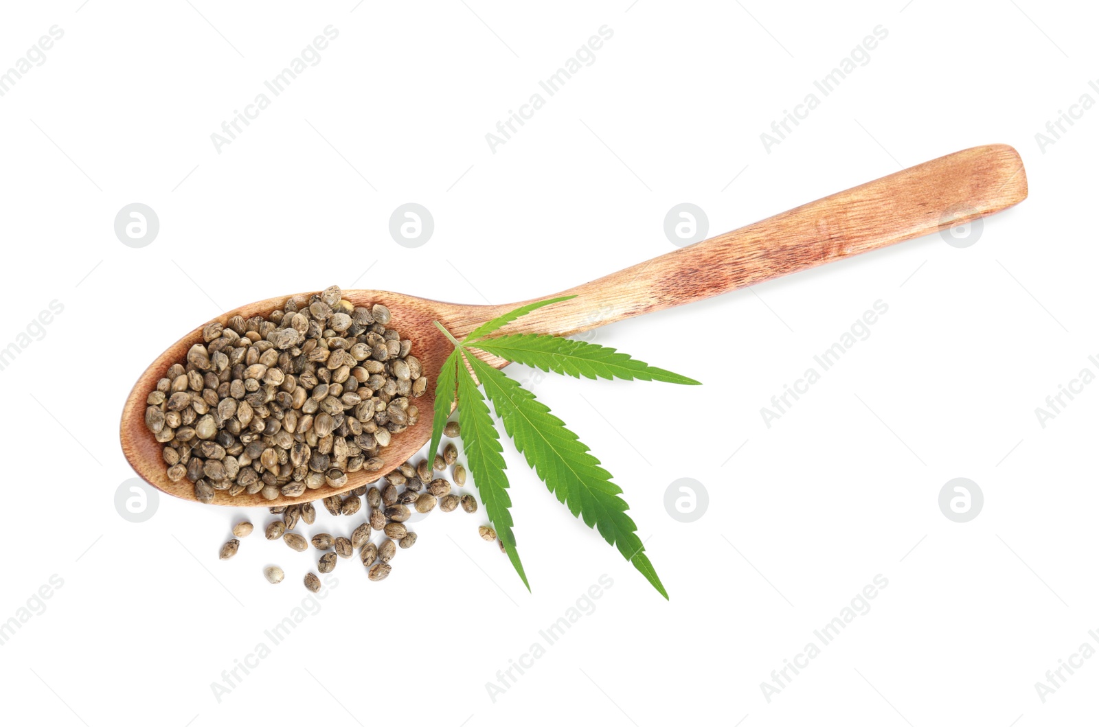 Photo of Wooden spoon with hemp seeds and leaf on white background, top view