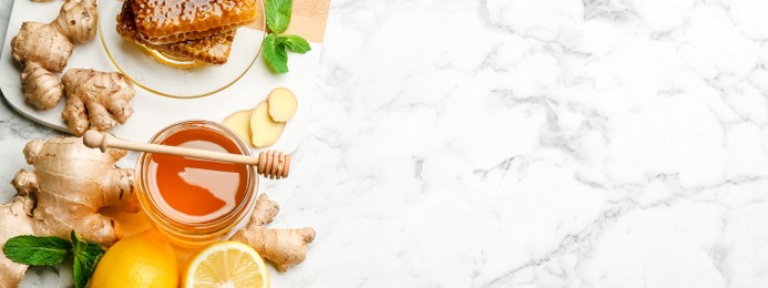 Tasty aromatic honey, lemon, ginger and mint on white marble table, flat lay with space for text. Banner design