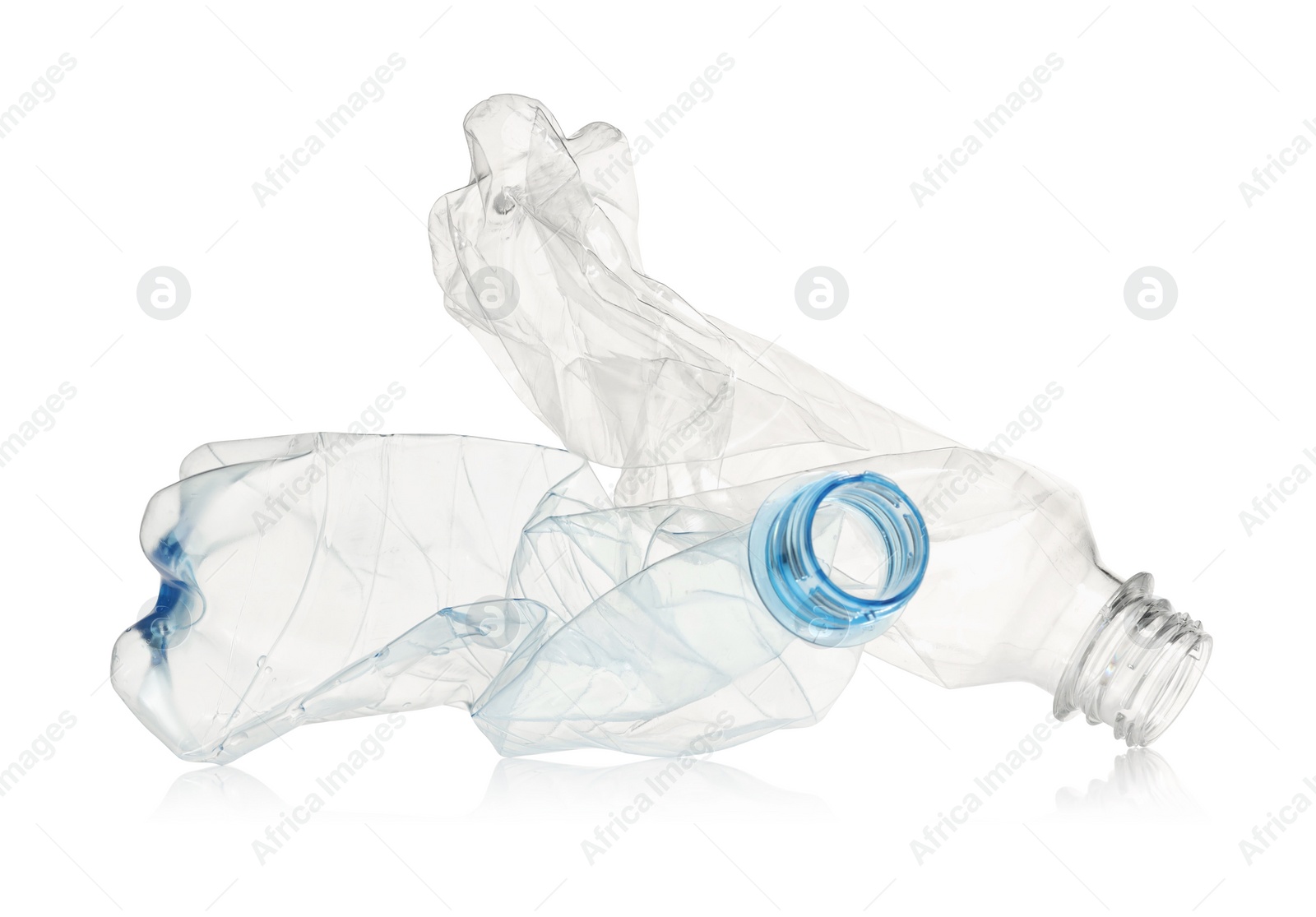 Photo of Crumpled disposable plastic bottles isolated on white