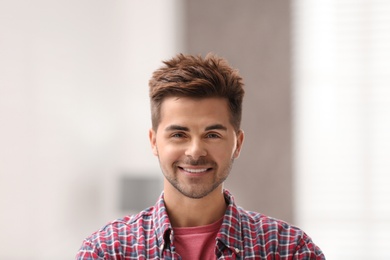 Photo of Portrait of handsome young man in room