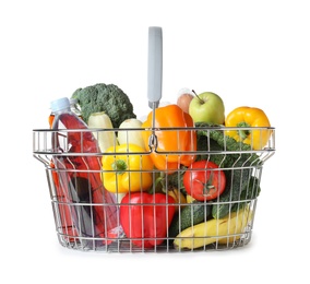 Photo of Shopping basket with grocery products on white background