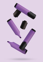 Image of Many violet markers falling on light background