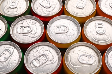 Energy drinks in wet cans, above view. Functional beverage