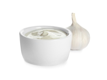 Photo of Bowl of homemade sauce and garlic isolated on white