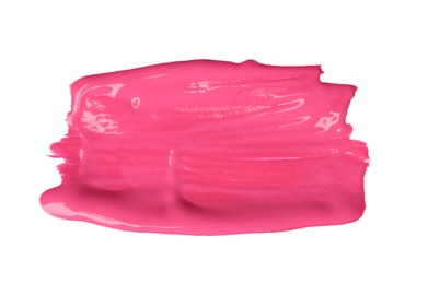 Photo of Abstract brushstroke of pink paint isolated on white