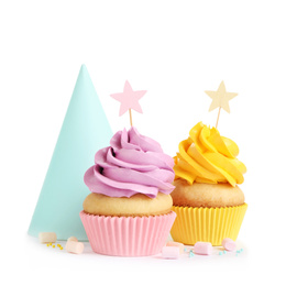Photo of Delicious birthday cupcakes and party cap on white background