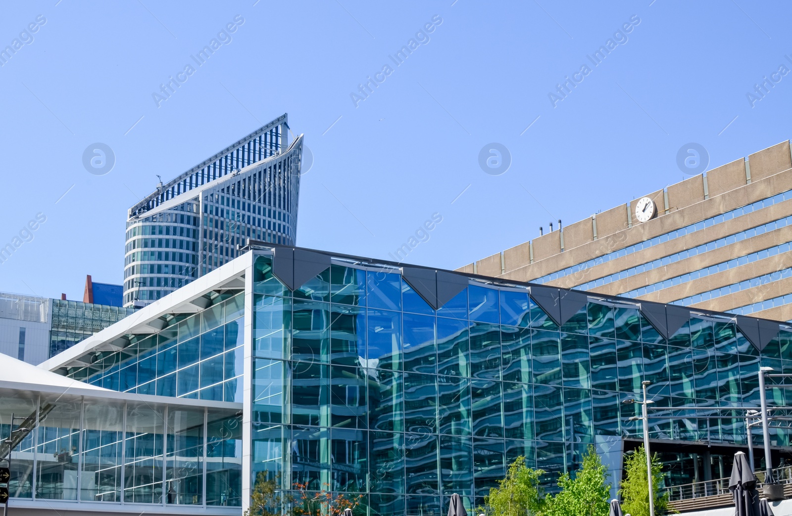 Photo of Exterior of beautiful modern buildings against blue sky