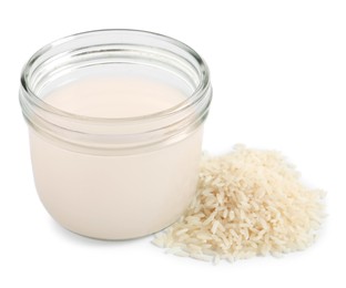 Photo of Homemade natural rice water and grains on white background