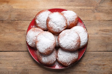 Photo of Delicious sweet buns on wooden table, top view