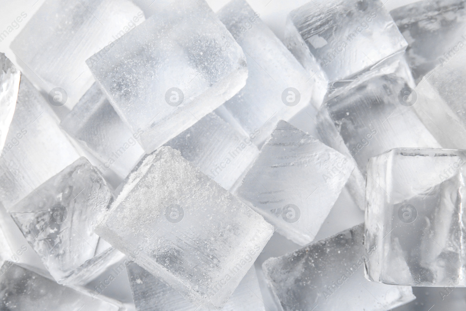 Photo of Many clear ice cubes as background, top view