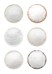 Set of bowls with salt on white background, top view