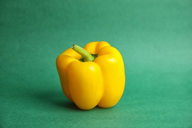 Photo of Raw ripe paprika pepper on color background