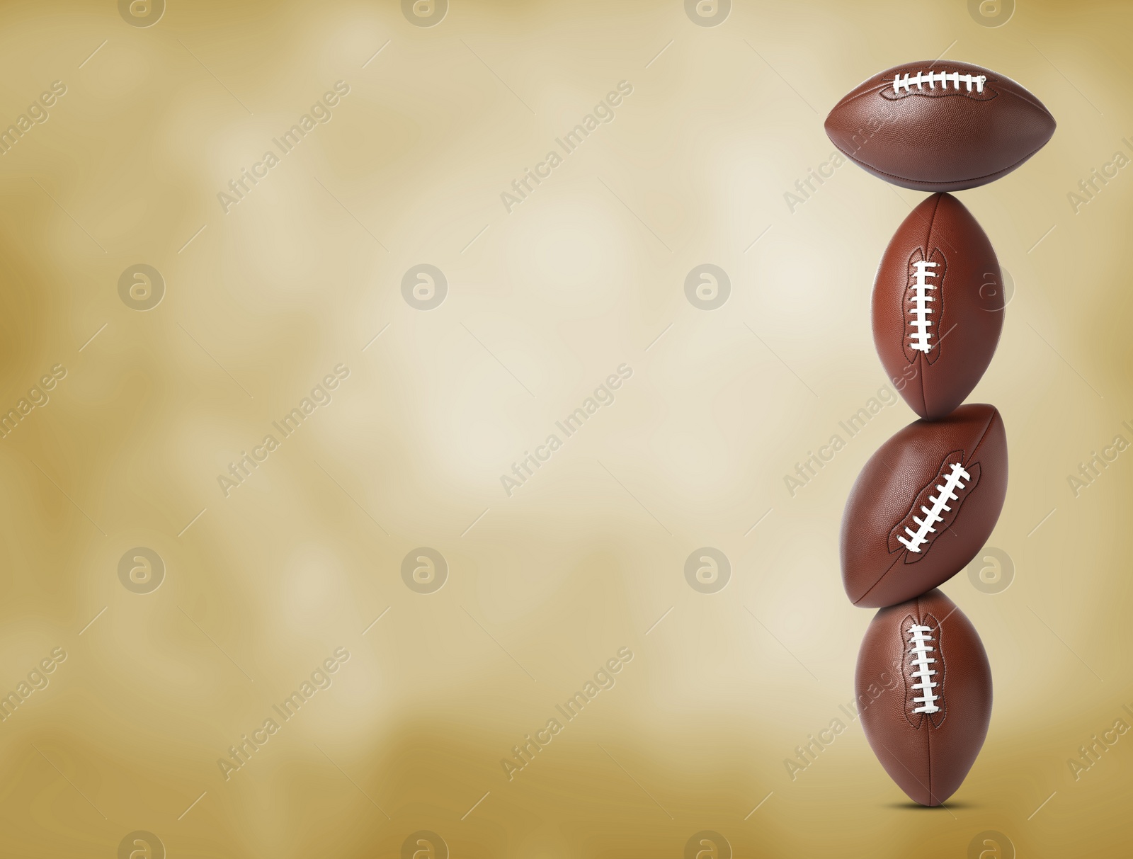 Image of Stack of American football balls on gold background. Space for text