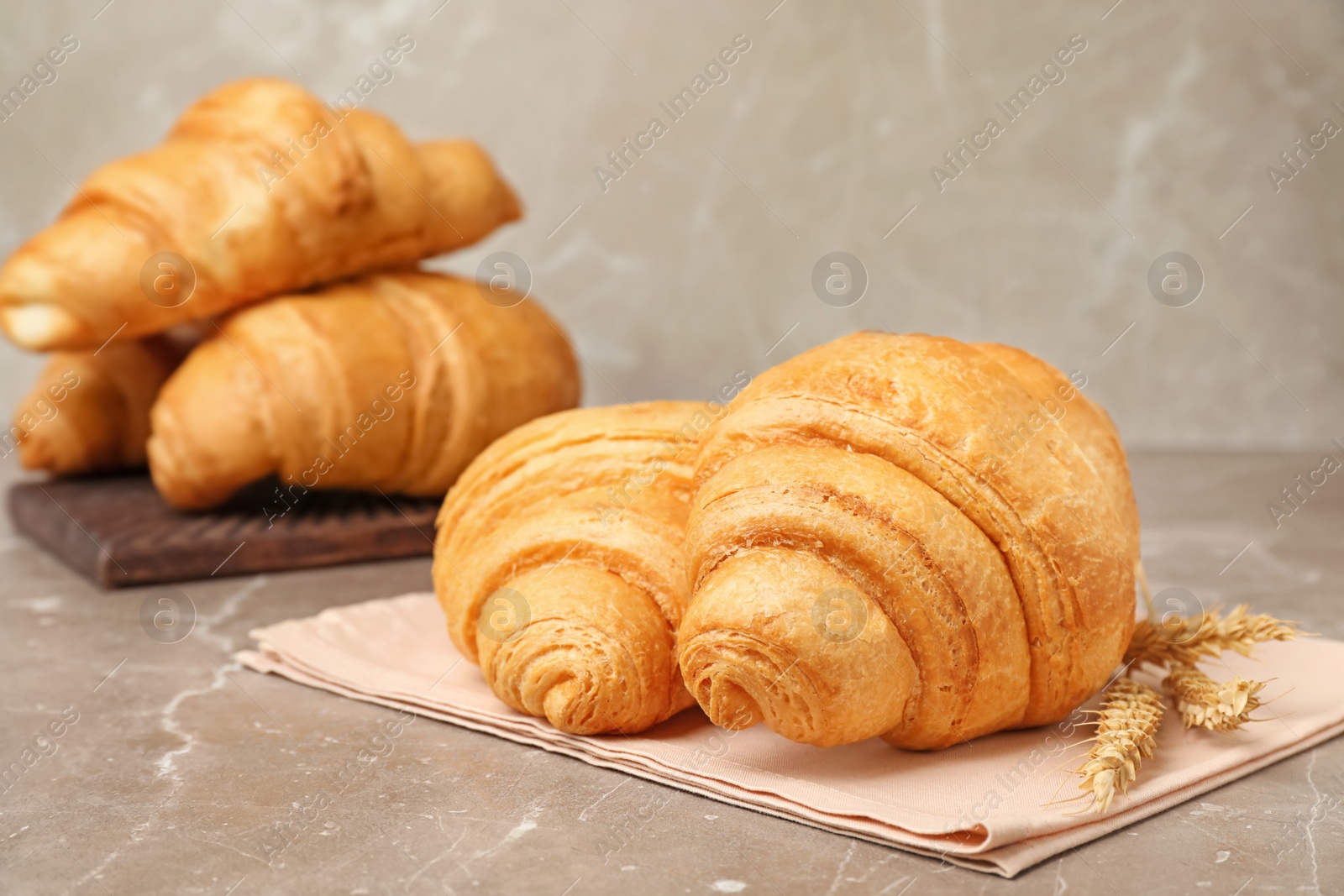 Photo of Tasty croissants served for breakfast on table