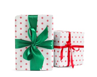 Beautifully wrapped gift boxes on white background