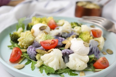 Delicious salad with cauliflower, tomato and cheese , closeup