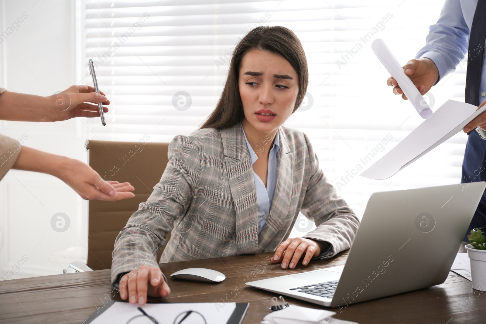 Photo of Businesswoman stressing out at workplace in office