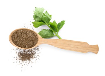 Photo of Spoon of celery seeds and fresh plant isolated on white, top view