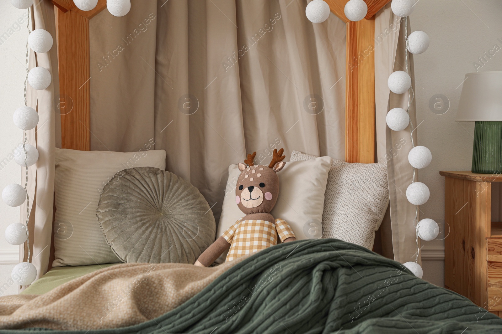 Photo of Toy deer on bed in child's room