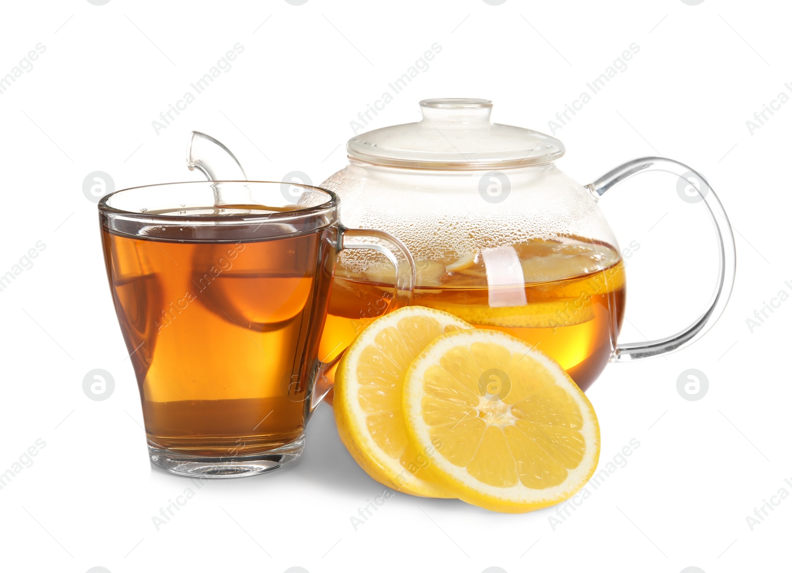 Photo of Cup and teapot with lemon tea on white background