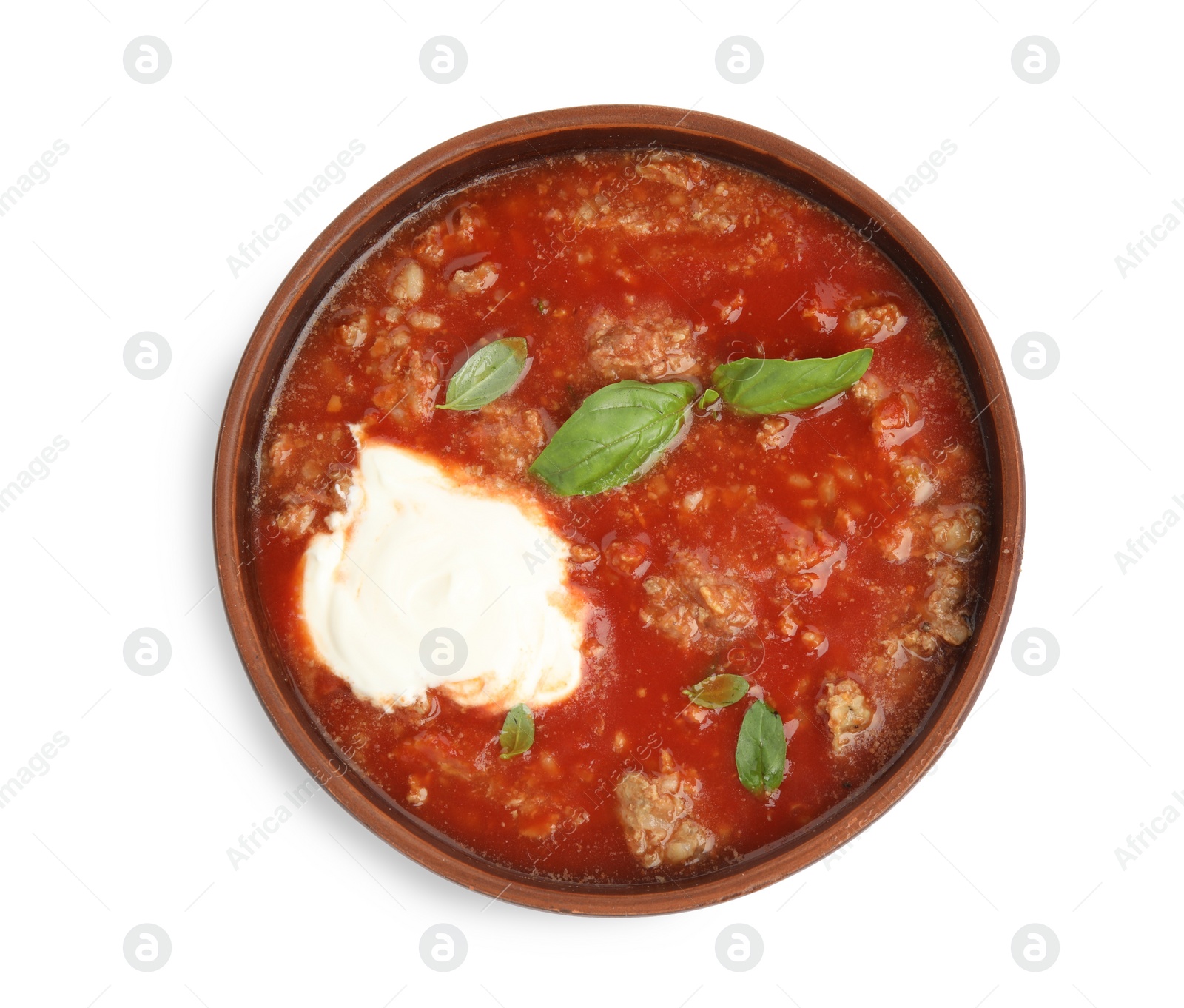 Photo of Bowl of delicious stuffed pepper soup on white background, top view