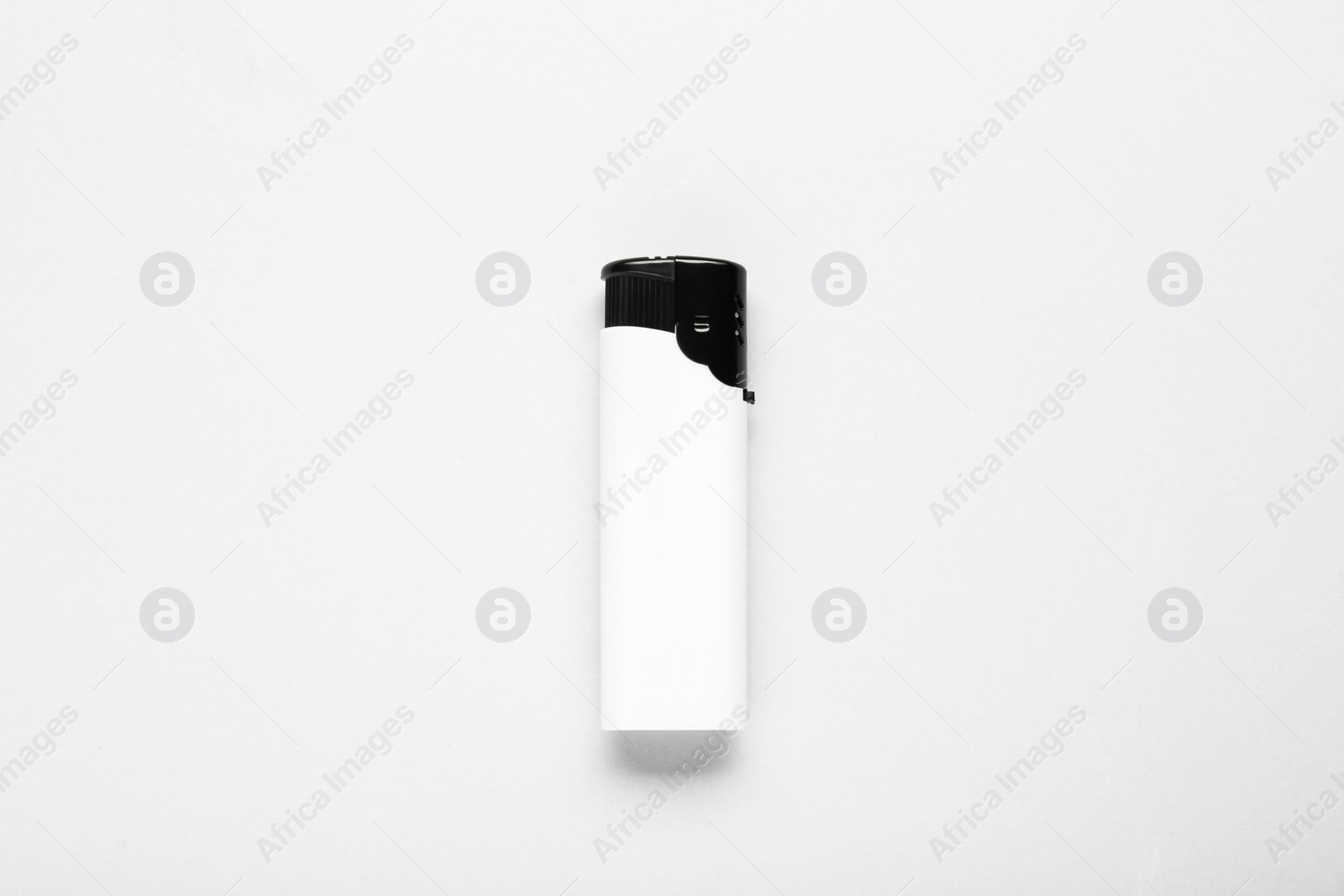 Photo of Stylish small pocket lighter on white background, top view